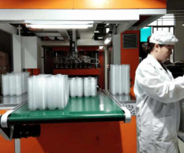 Modern manufacturing facility with advanced thermoforming equipment